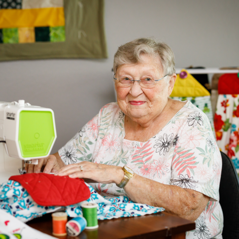 Senior female member working on a sewing project