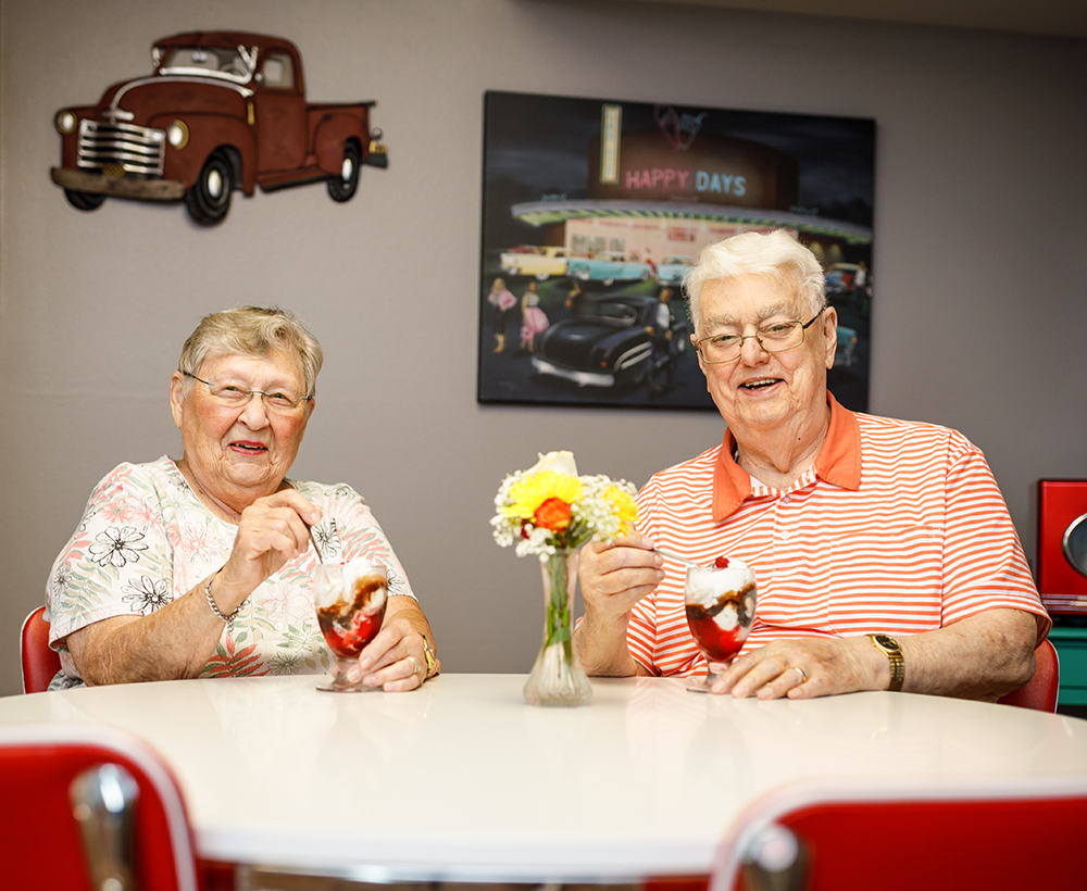 Senior couple enjoying sundaes in our "diner."