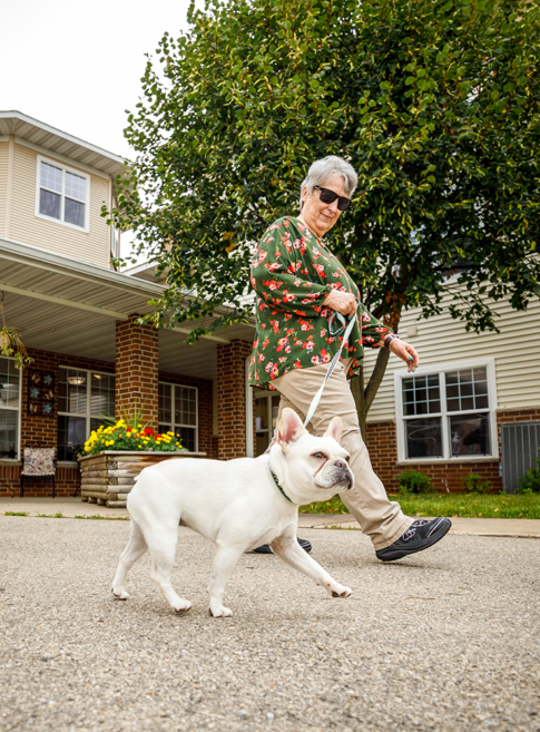 Female resident walking her dog