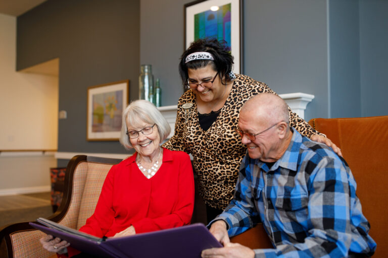 Senior couple looking at a photo album