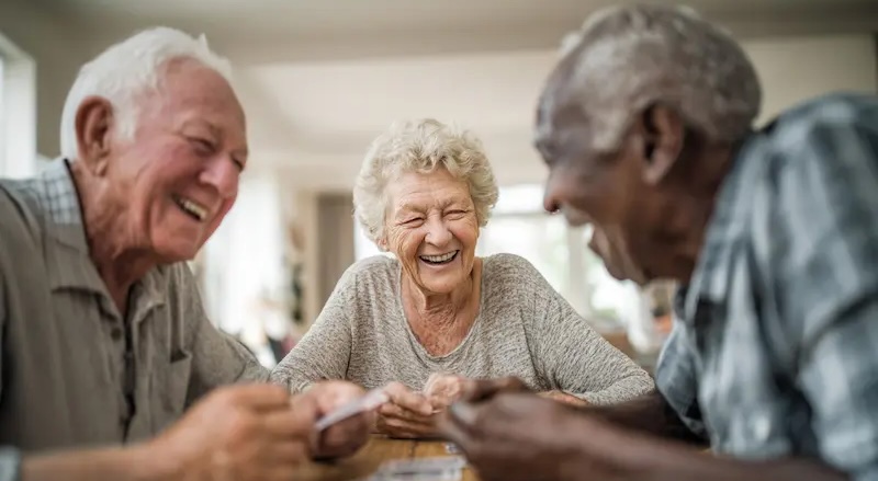 Parkside Cares | Seniors playing cards laughing