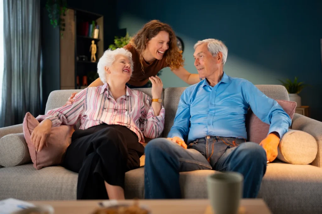 Senior couple discussing living options with daughter